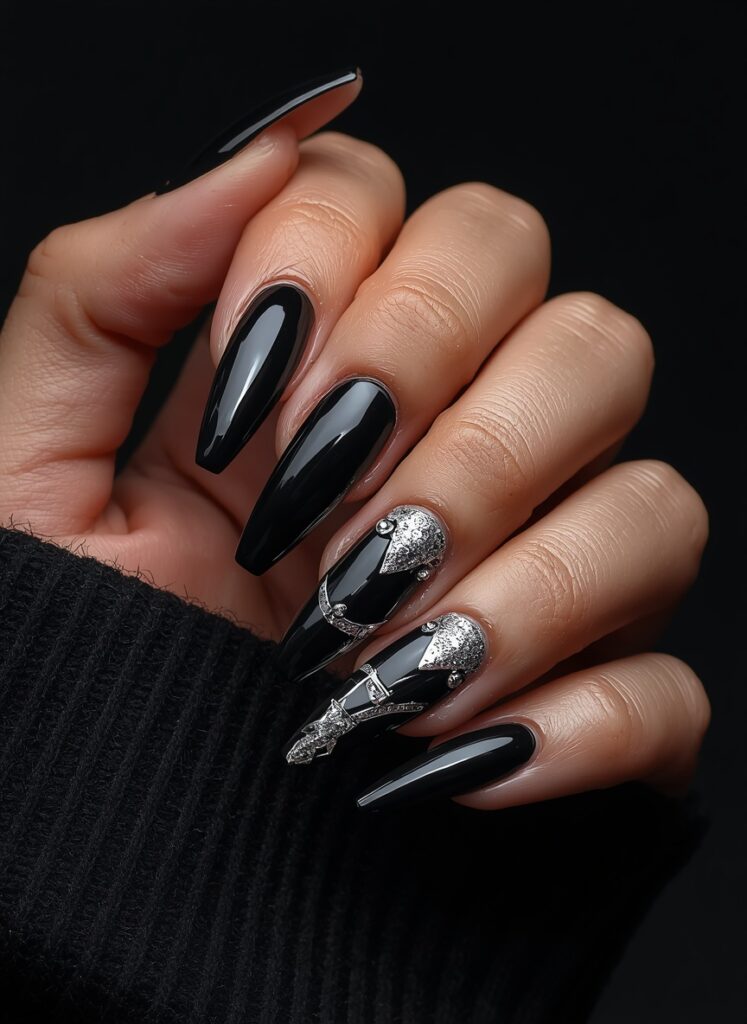 Black lace nails with glossy finish and elegant gothic stiletto manicure design