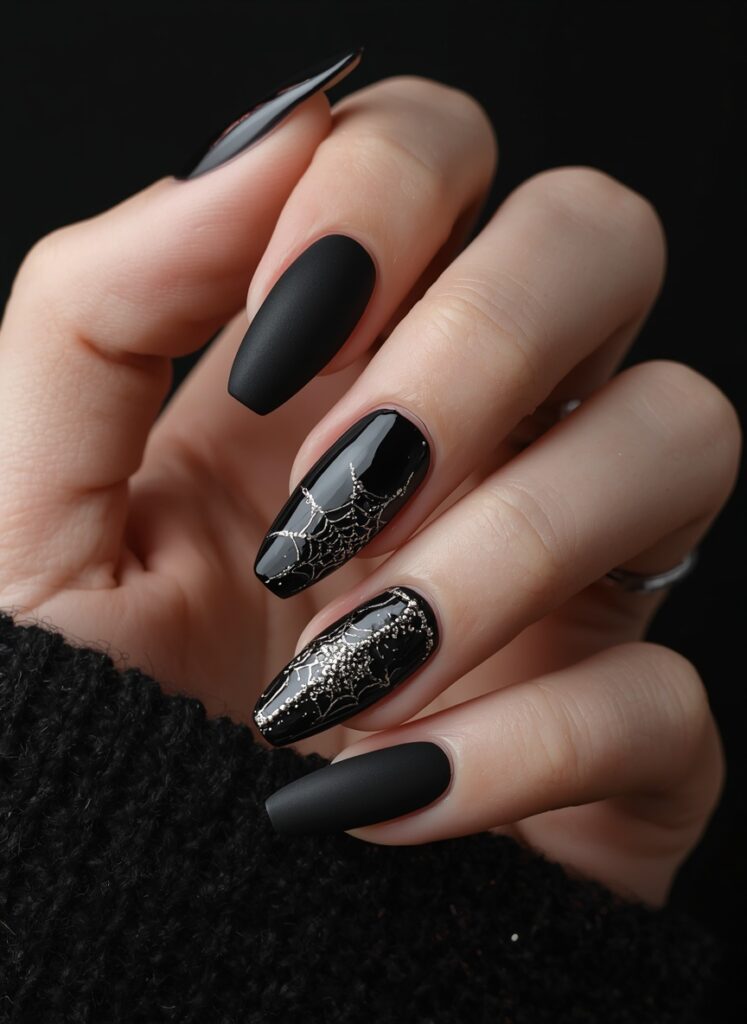 Black Halloween nails with silver spider web details, matte and glossy gothic manicure design