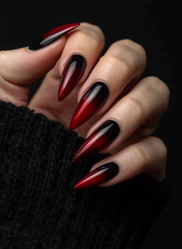 Dark red and black ombre stiletto nails with glossy gothic Halloween manicure design